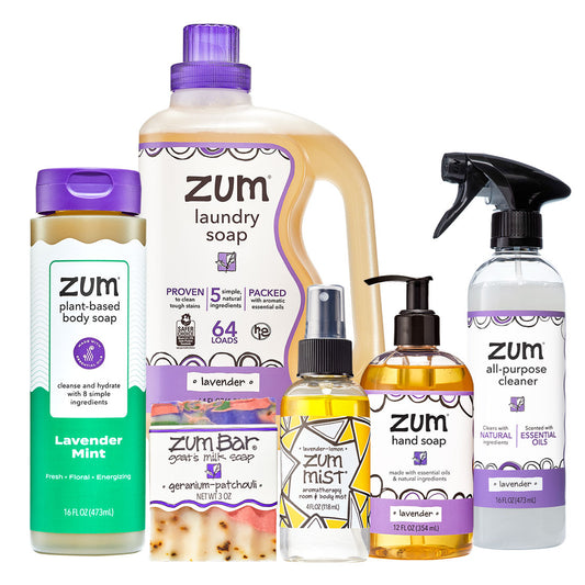 Collection of Zum cleaning products including laundry soap, hand soap, and cleaner on a white background.
