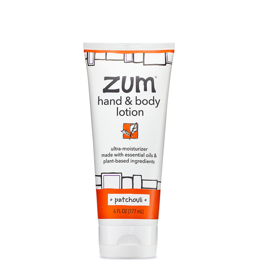 White Squeeze tube with orange and black design that contains patchouli scented hand and body lotion.