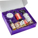Zum holiday products including Frosted Fir, Peppermint-Vanilla, and Vanilla Spice in a purple gift box with purple crinkle paper.