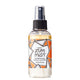 Labeled Aromatherapy Room & Body Mist bottle with a sprayer in the scent Amber.