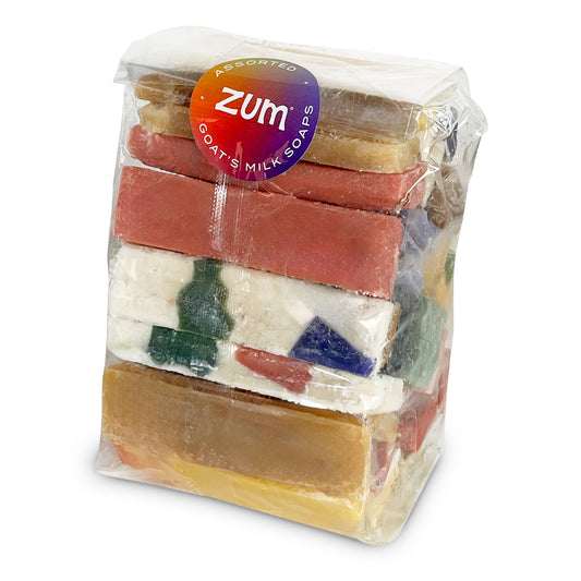 Clear bag tied with a bow that contains a pound of assorted colored and assorted scented Zum Bar Soap slivers