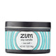Side view 7 oz Sea Salt Candle in a black tin with blue and white label that has circular designs.