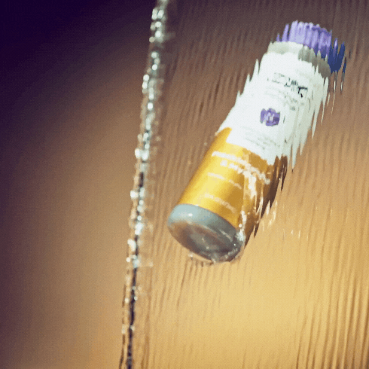 Frankincense & Myrrh Body Soap Bottle falling through water stream