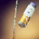 Frankincense & Myrrh Body Soap Bottle falling through water stream