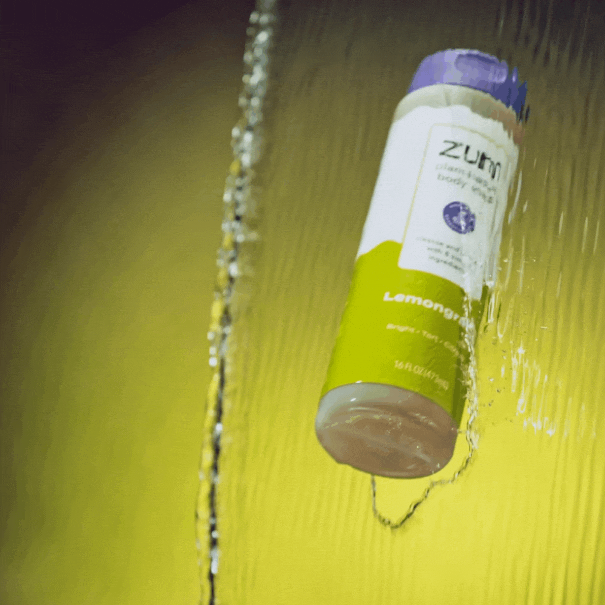 Lemongrass Body Soap bottle being tossed through waterfall