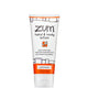 White Squeeze tube with orange and black design that contains patchouli scented hand and body lotion.