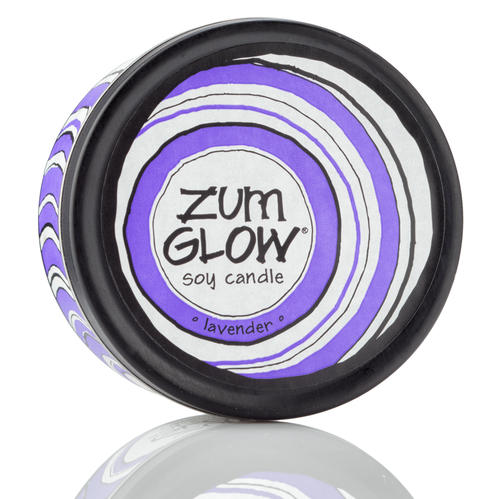 Top view 7 oz Lavender Candle in a black tin with purple and white label that has circular designs.