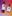Frankincense & Myrrh Body Wash and Neroli Hand Soap flying in the air. Purple to orange gradient background.