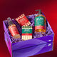 Peppermint-Vanilla scented mist bottle and bar soap, and Winter Pine scented bar soap and hand soap bottled inside a purple box filled with purple crinkle. Box is sitting on a mirrored surface. Red gradient background. 