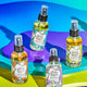Amber, Lavender-Mint, Lavender, and Lemongrass Zum Mists standing and laying on purple, green, and blue shapes.