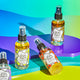 Lavender, Lemongrass, Patchouli, and Frankincense & Myrrh Zum Mists standing and laying on purple, green, and blue shapes.