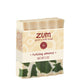 A 3 oz bar of Zum Goat's Milk Soap in the Holiday Almond scent, featuring a cream-colored bar with green and white marbled pattern details and a beige paper label.