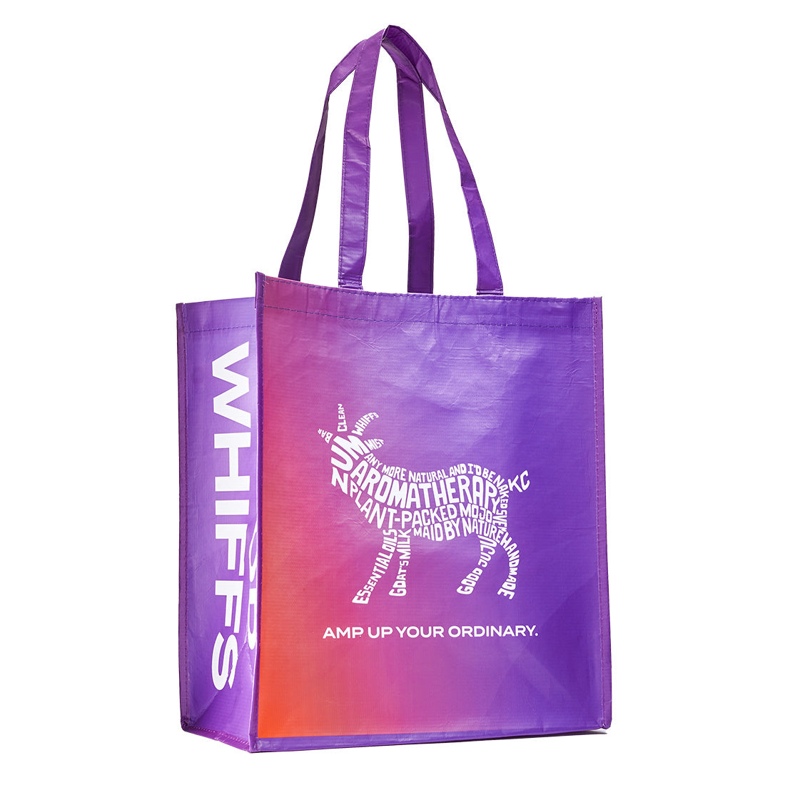 Zum recyclable tote bag at an angle. Goat and the slogan 'Amp Up Your Ordinary.' in the front on an orange to purple gradient. Side of the tote says 'Good Whiffs' on purple background.