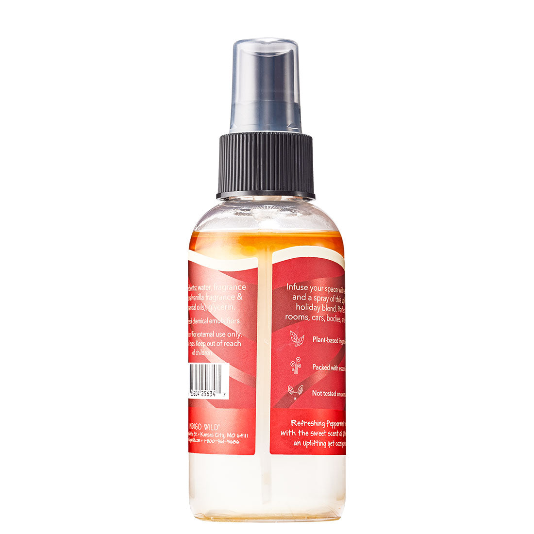 Back of clear mist bottle with liquid inside and red label wrapped around. 