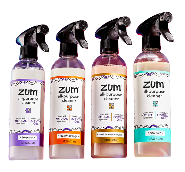 Lavender, Sweet Orange, Frankincense & Myrrh, and Sea Salt All-Purpose Cleaner bottles with a sprayer lined up on a transparent background.