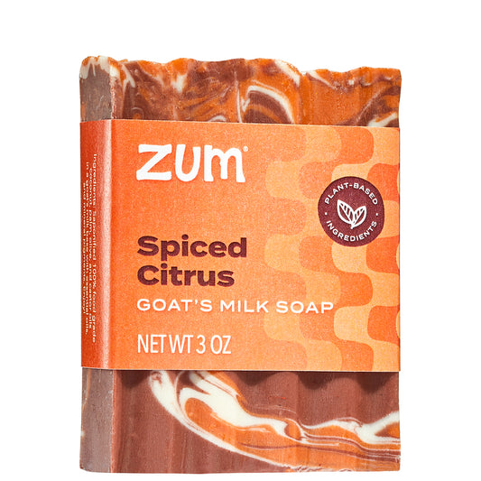 Red, orange, and white swirled Bar Soap With orange label wrapped around the middle.
