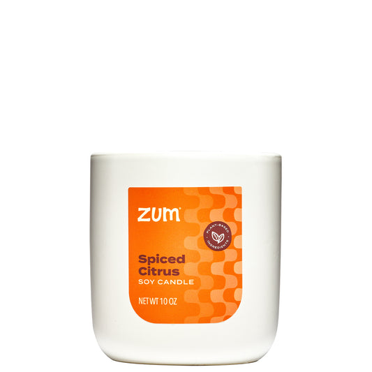 10 oz. Soy Candle in a white container with orange label on front.