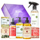 A Zum gift set featuring a purple branded box and an assortment of Holiday Zum home care products.