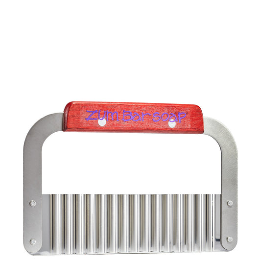 Silver bulk brick wavy cutter with wood grip with the purple words Zum Bar Soap on it.