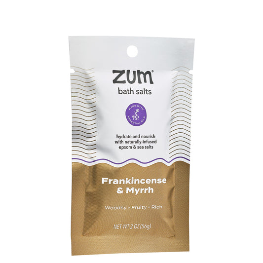 Tearable packet with brown, black, and purple design containing Frankincense & Myrrh scented bath salts.