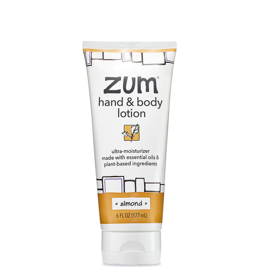 White tube with black and light brown design containing Almond scented body lotion.