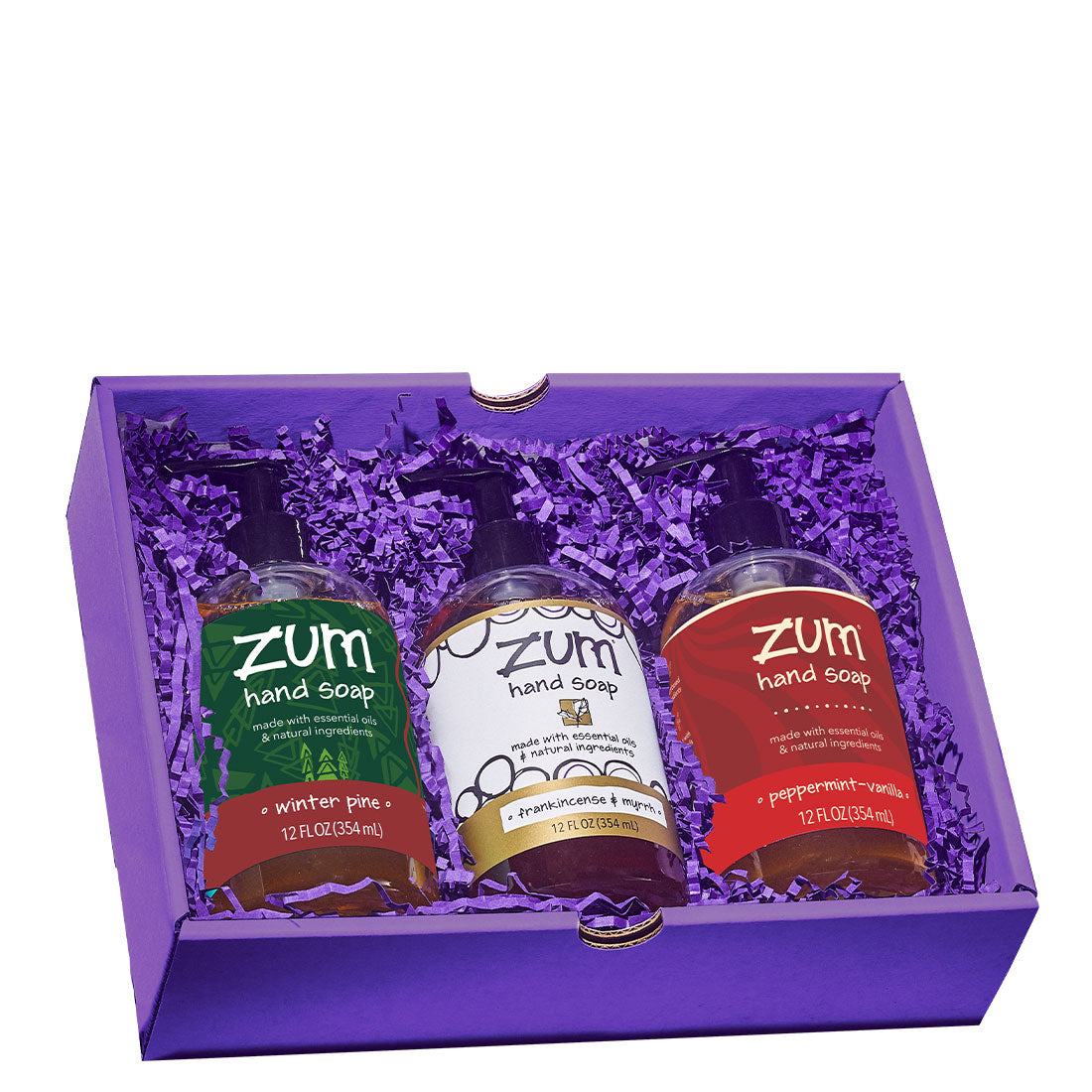 Three Zum Hands Soaps in a purple box with purple crinkle surrounding them.