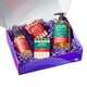 purple gift box filled with two bars of soap and two hand soap bottles