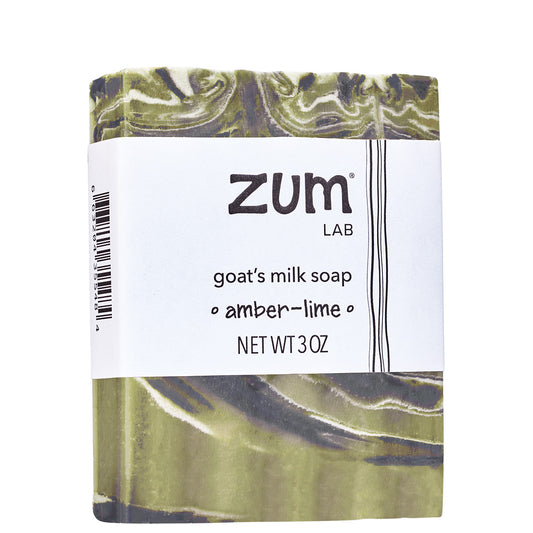 Green, white, and black swirled soap bar with white label.