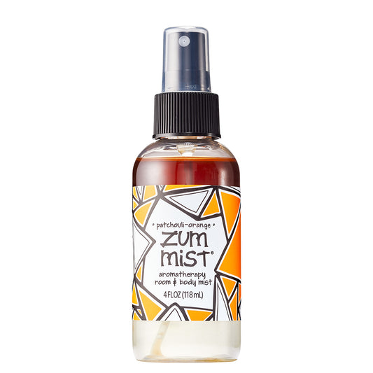 Labeled Aromatherapy Room & Body Mist bottle with a sprayer in the scent Patchouli-Orange.