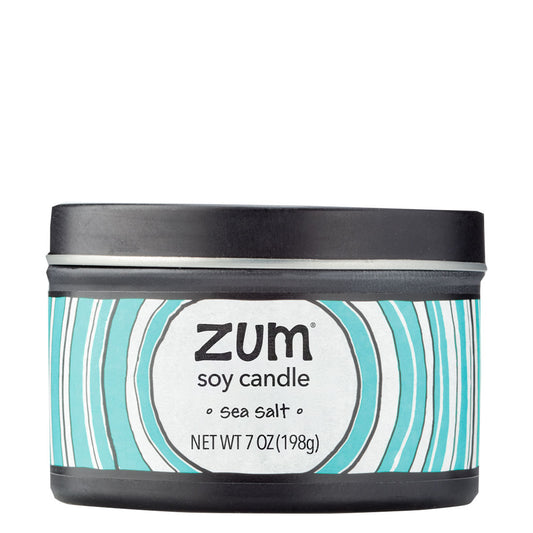 Side view 7 oz Sea Salt Candle in a black tin with blue and white label that has circular designs.