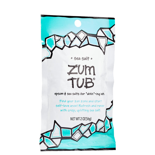 Tearable packet with blue and black design containing sea salt scented bath salts