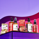 mix of peppermint-vanilla and frosted fir products on a purple shelf.