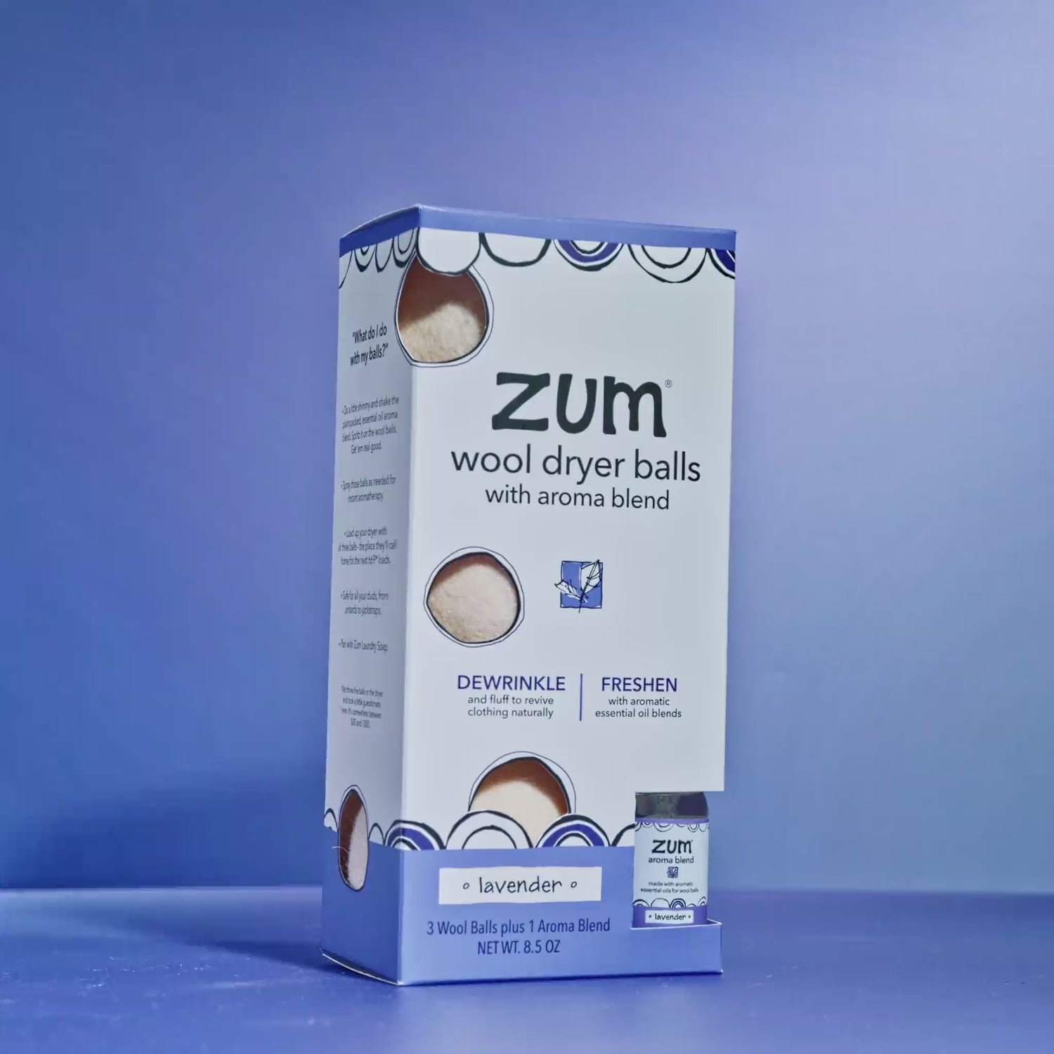 Lavender Wool Dryer Balls Sitting on purple background with wool dryer balls bouncing around.