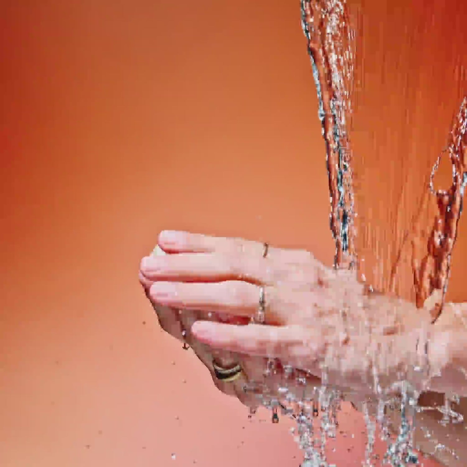 Patchouli Bar Soap Lathering under water and orange background