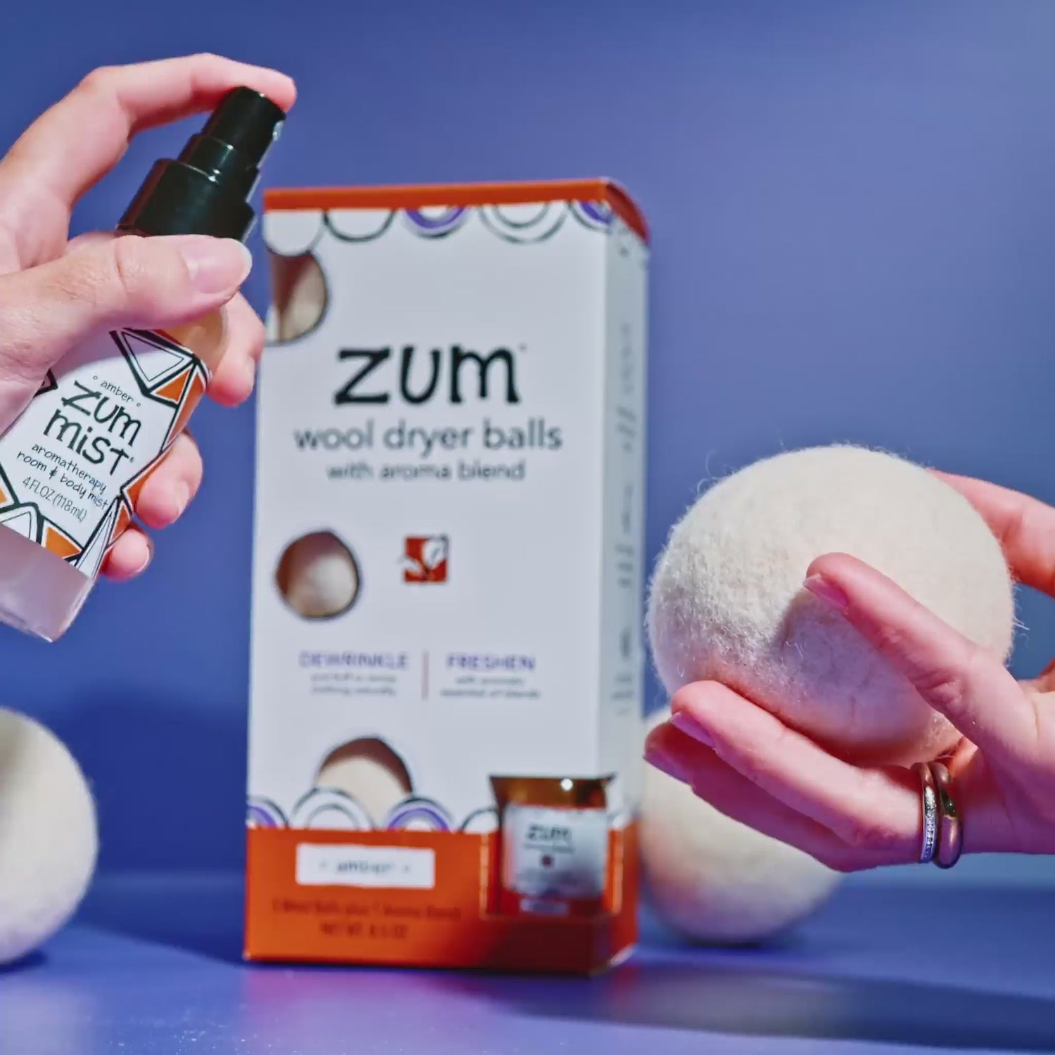 Wool Dryer Ball being spritzed with Amber Zum Mist