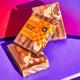 Spiced citrus bars stacked on top of one another.