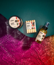 Zum Vanilla Spice products including a jar, soap bars, and spray bottle on a colorful background