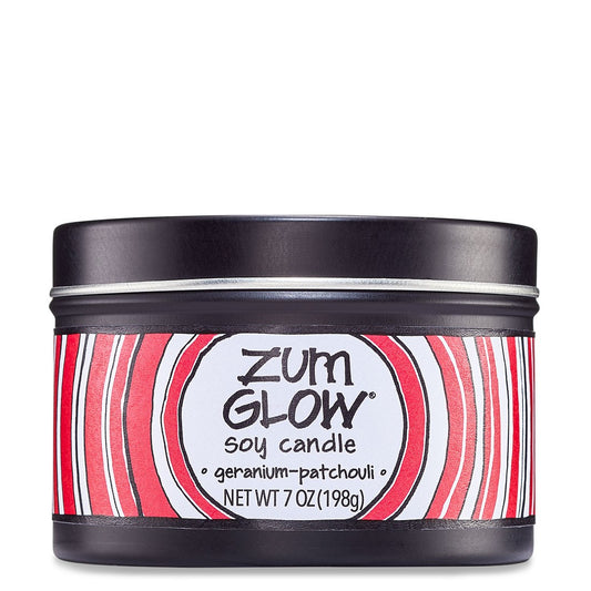 Black soy candle with Pink Geranium-Patchouli label.