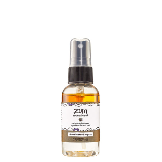 Small bottle with sprayer top containing frankincense & myrrh scented aroma blend for wool dryer balls.