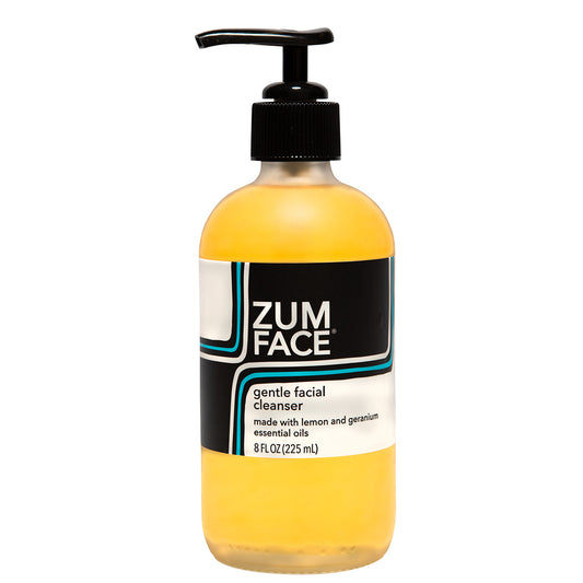 Frosted glass bottle with pump that contains Zum Face cleanser.