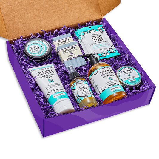 Large purple gift box filled with crinkle and assorted Sea Salt Zum products.