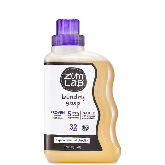 Plastic bottle with purple cap containing geranium-patchouli scented laundry soap liquid