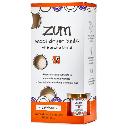 White and orange box containing three wool dryer balls with aroma blend bottle included. 
