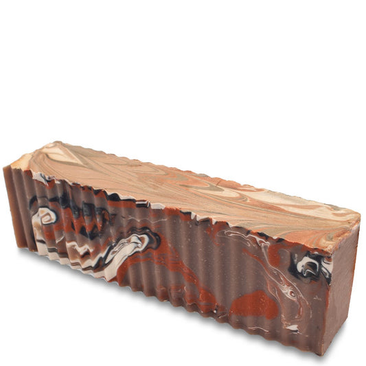 White, brown, and rust colored soap brick scented Amber