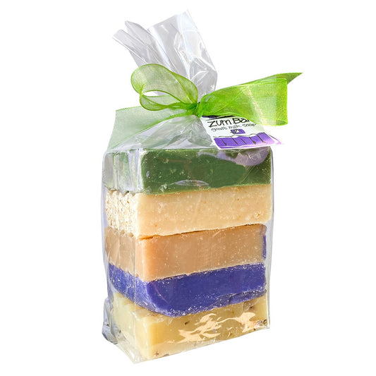 Clear bag tied with a bow containing a pound of assorted colored and assorted lavender scented Zum Bar Soap Pieces