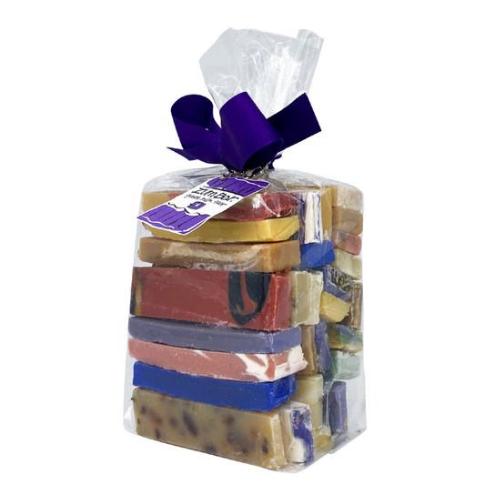 Clear bag tied with a bow that contains a pound of assorted colored and assorted scented Zum Bar Soap slivers
