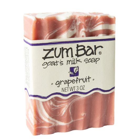 Labeled grapefruit scented Zum Bar Soap with pink and white colored swirls.