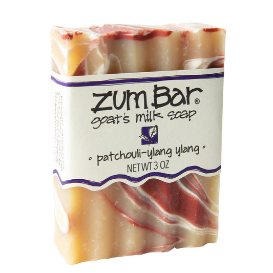 Labeled patchouli-ylang ylang scented Zum Bar Soap with brown, white and red colored swirls 