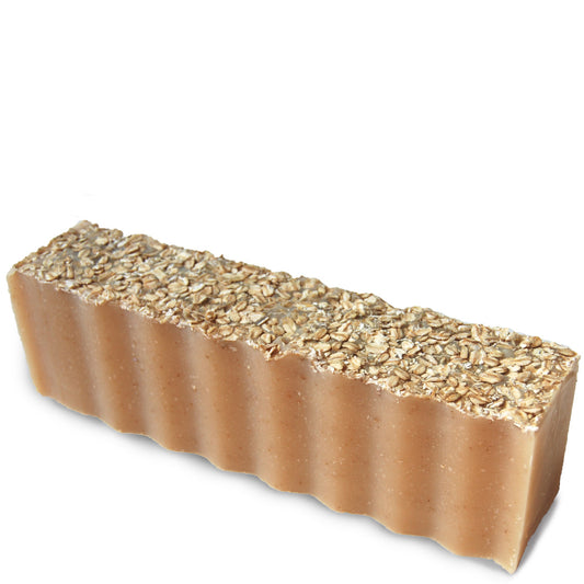 Oatmeal topped cream colored wavy rectangular 45 ounce brick of lavender scented Zum Bar Soap