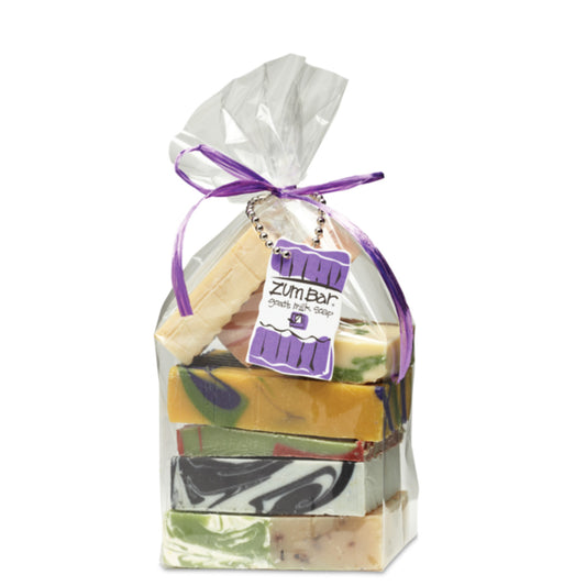 Clear bag tied with a bow that contains a pound of assorted colored and assorted scented Zum Bar Soap pieces